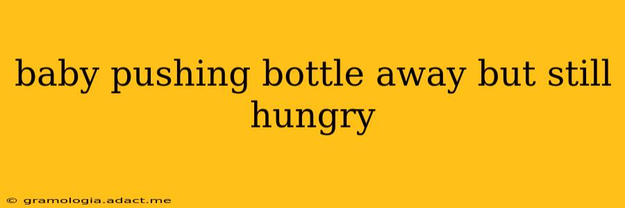baby pushing bottle away but still hungry