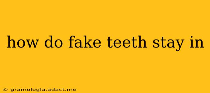how do fake teeth stay in